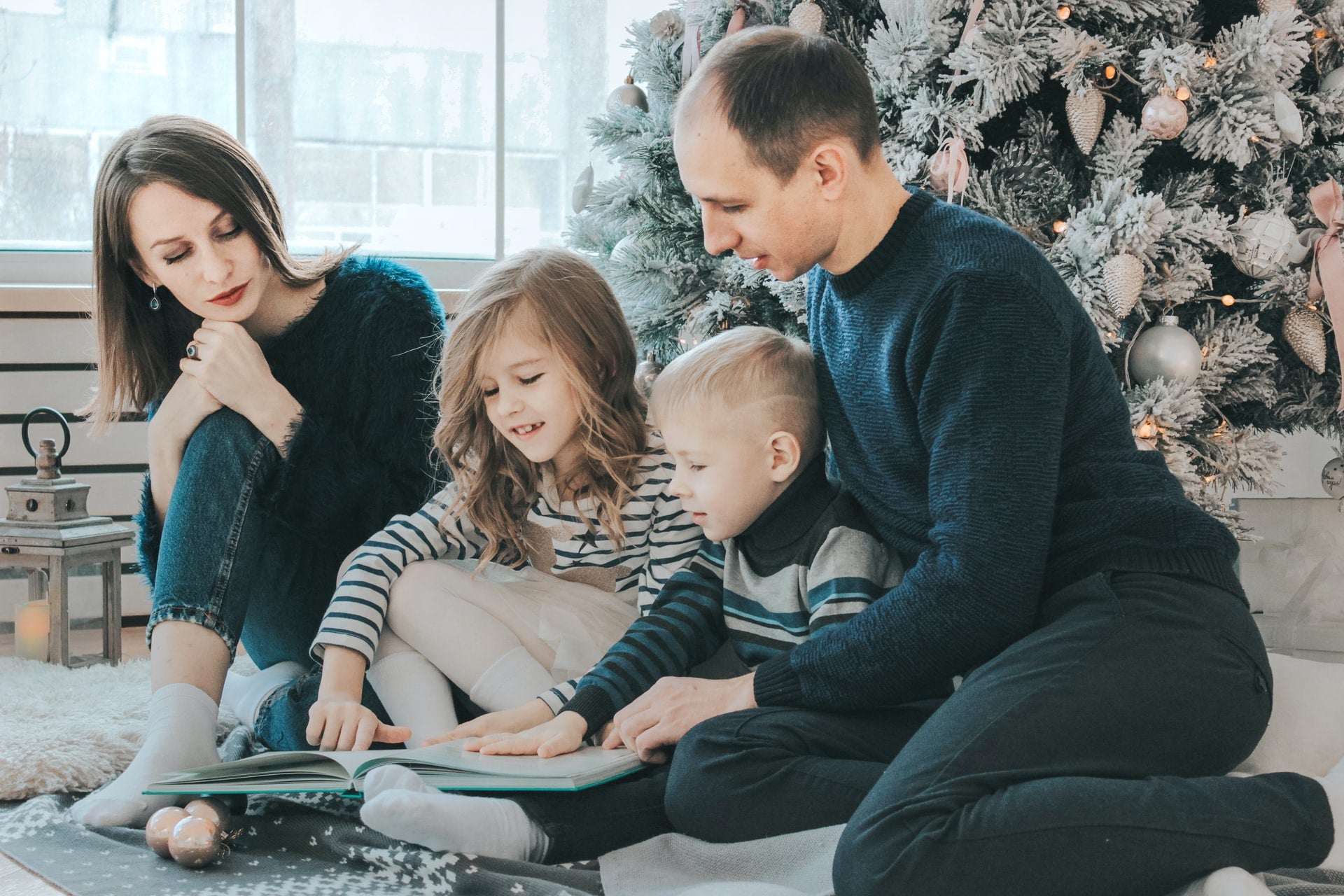 family reading book to reduce screen time