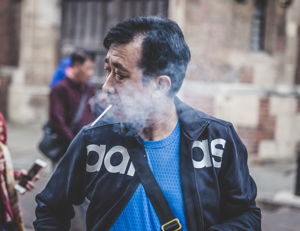 man smoking a cigarette