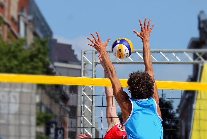 people playing volleyball to get fit and stay healthy