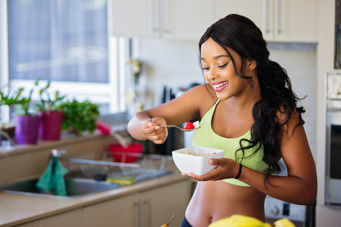 woman eating strawberries for whiter teeth