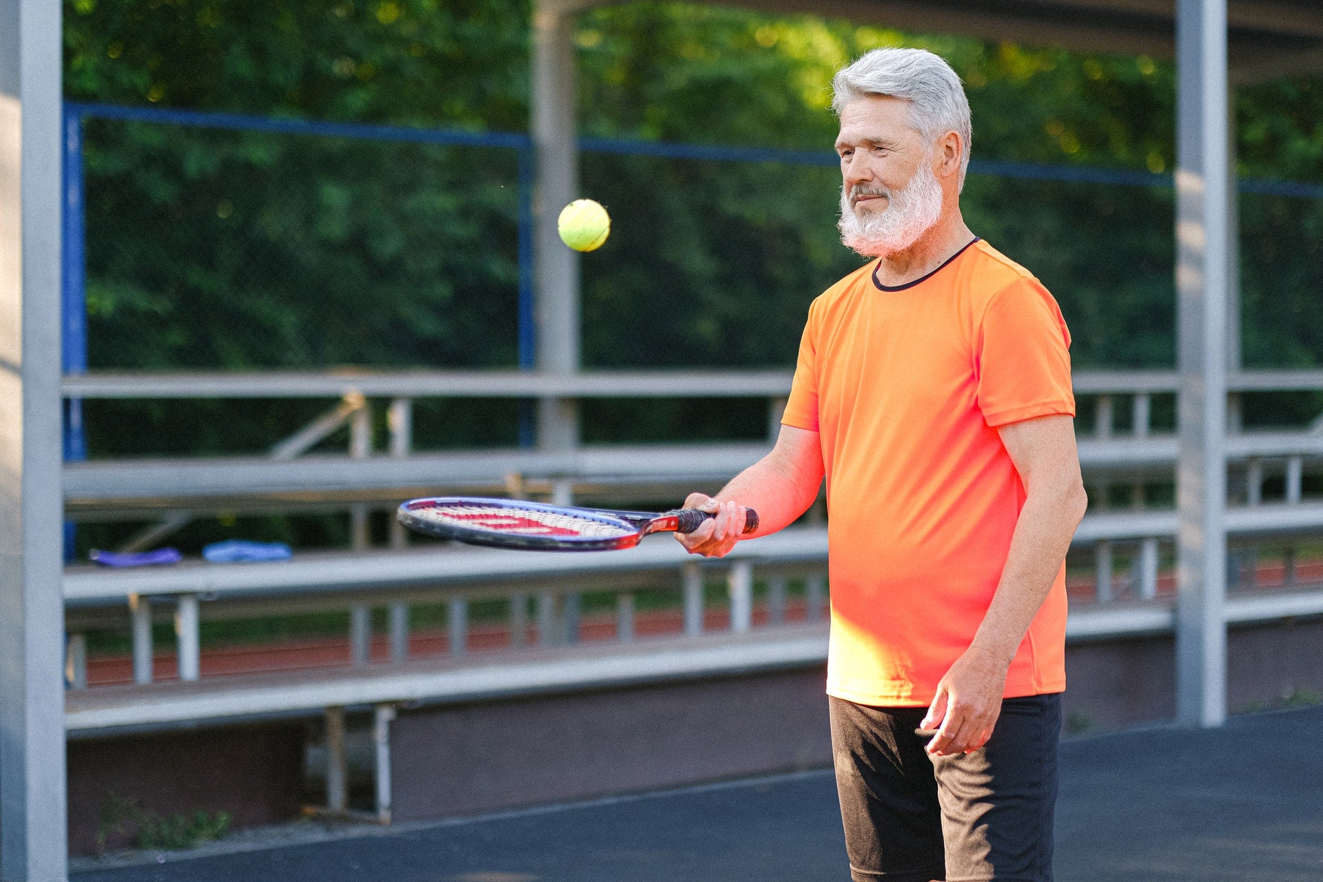 man holding tennis racket
