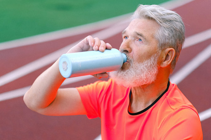 man drinking protein supplement