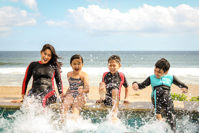 woman and children swimming