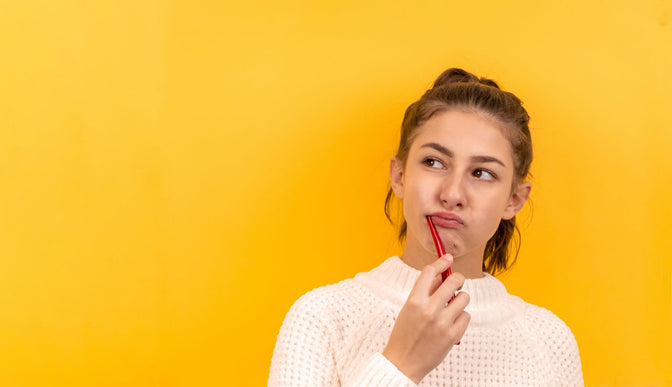 teen brushing her teeth