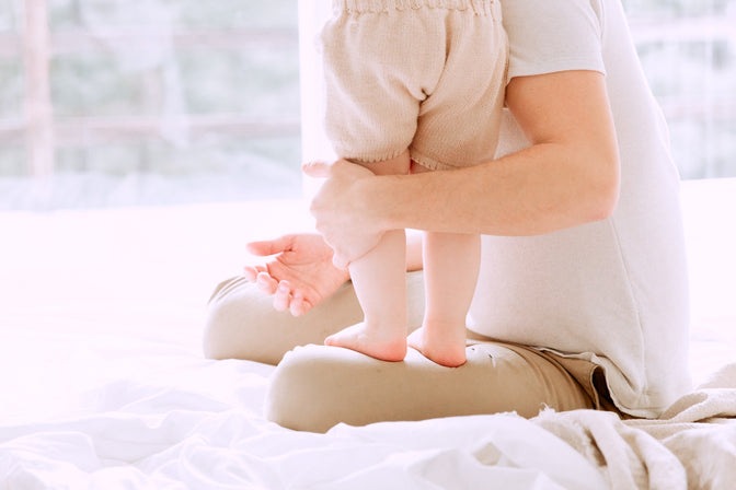 woman holding toddler with eczema