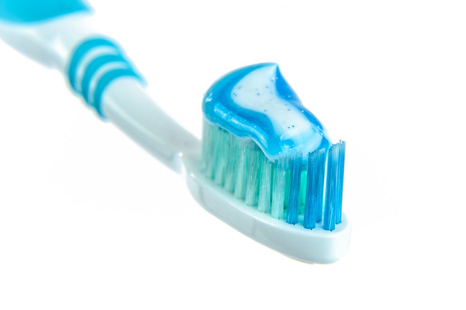 toothpaste on toothbrush