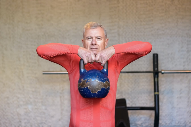 man exercising with kettlebell