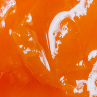 Close-up of orange and white abstract liquid pattern