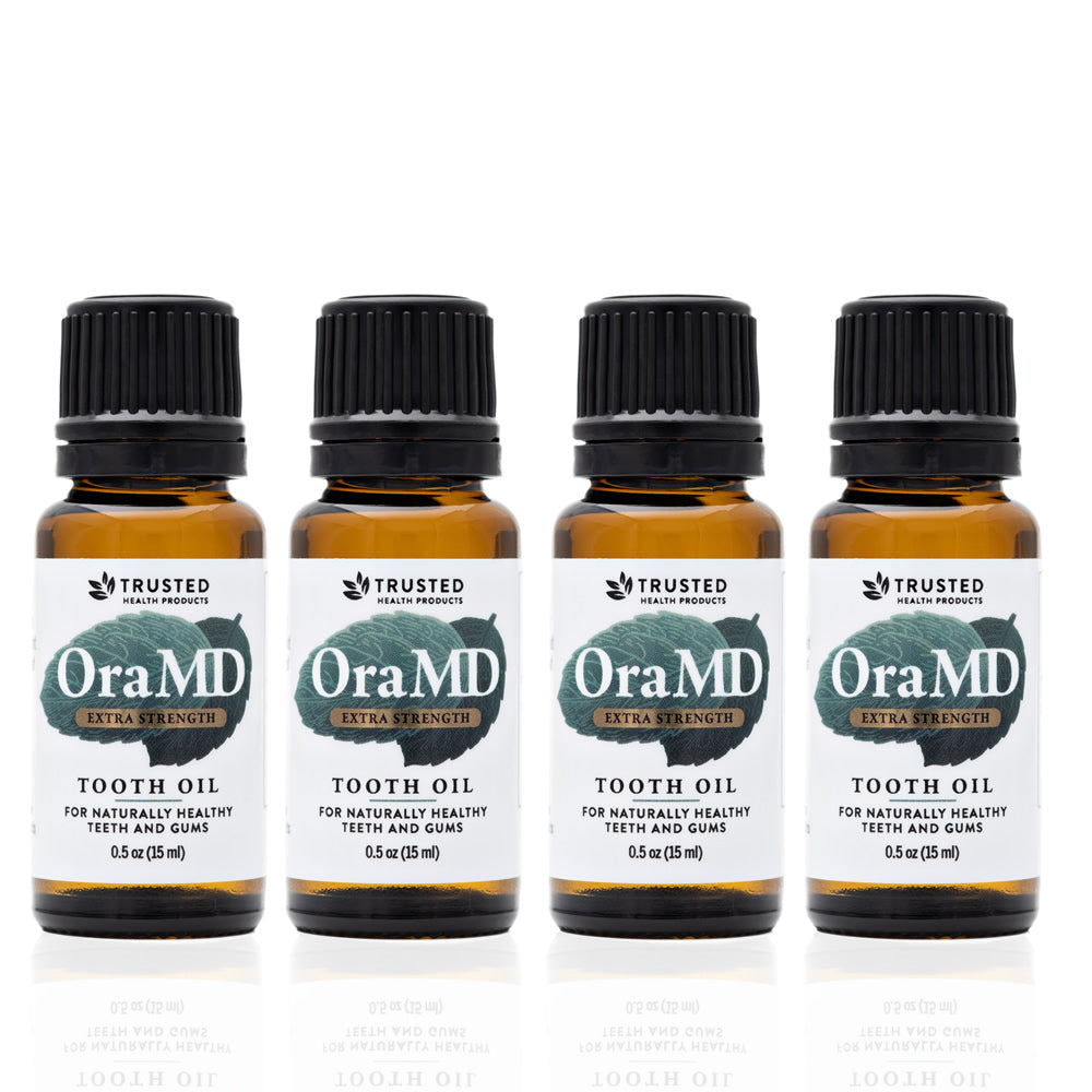 4 Pack of OraMD Extra Strength Tooth Oil on a white background