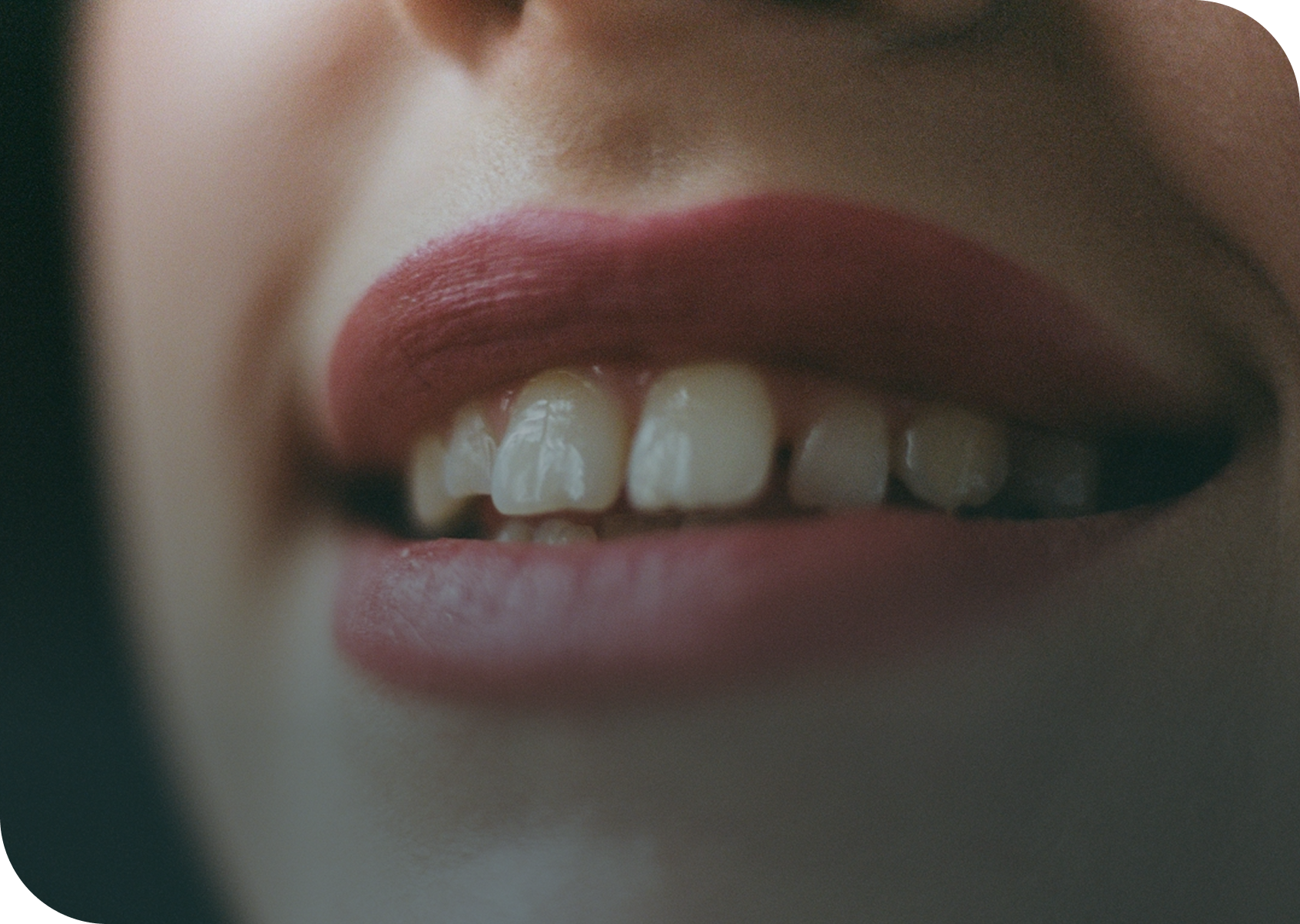 Close-up of a person's mouth with visible teeth