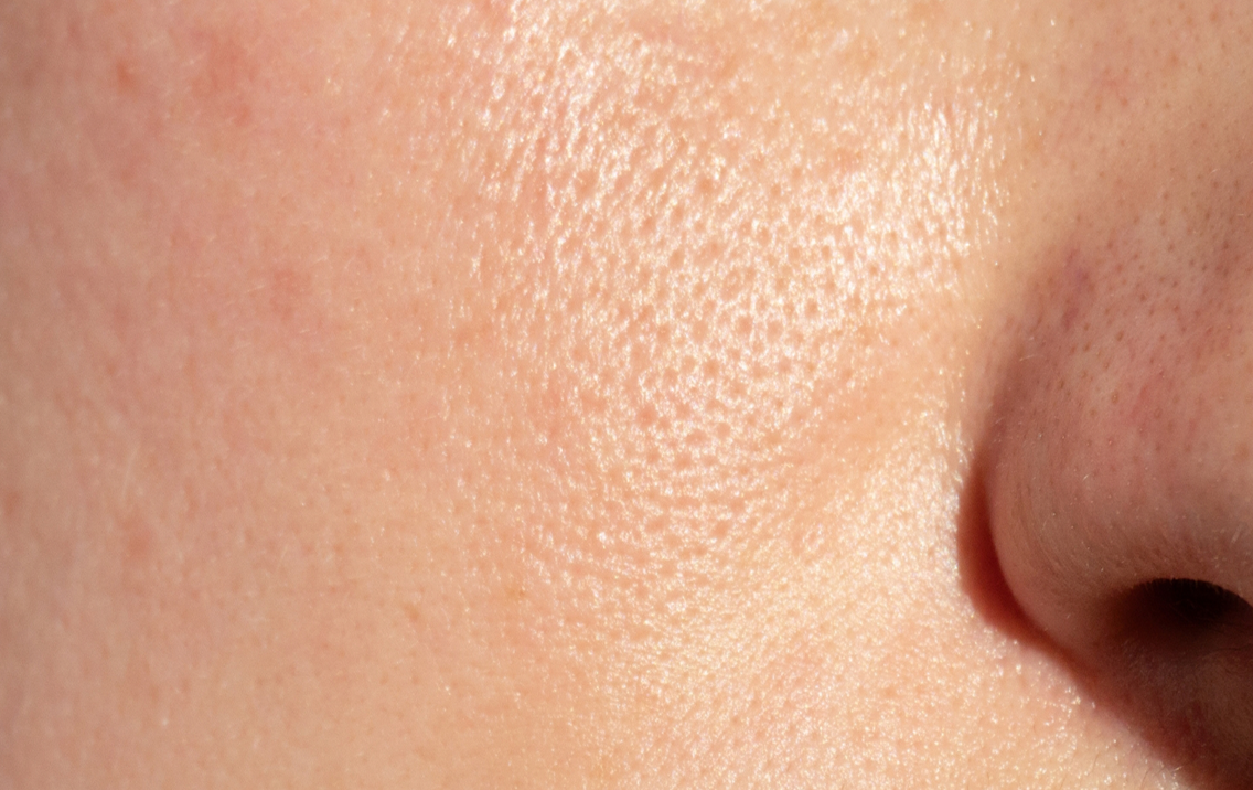 Close-up of a person's nose with skin texture