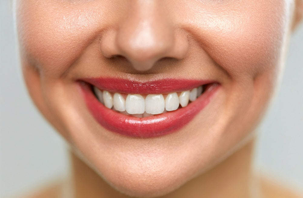 A person smiling with their teeth showing
